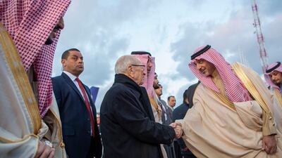 King Salman is welcomed by President Essebsi upon his arrival. EPA