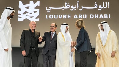 Sheikh Nahyan bin Mubarak, Minister of Culture, Youth and Community Development shakes hands with Francoise Nyssen, the French minister of culture, after announcing the opening date with Mohamed Khalifa Al Mubarak, chairman of Abu Dhabi Tourism & Culture Authority, right; and from left, Saif Ghobash, Director General of TCA, Jean-Luc Martinez president-director of the Louvre museum, 2nd left, and Jean Novel the architect of Louvre Abu Dhabi. All photos by Christopher Pike / The National