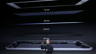 Philip Schiller, senior vice president of worldwide marketing at Apple, introduces the new iPad Air. Robert Galbraith / Reuters