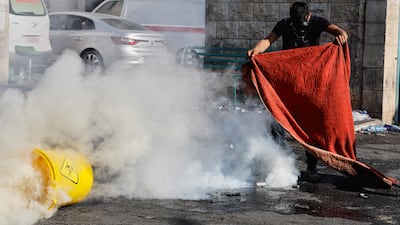 A man wears a mask for protection from tear gas. Reuters