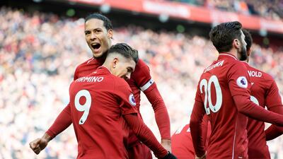 Liverpool's Roberto Firmino, left, celebrates putting Liverpool 2-1 ahead against Burnley. EPA