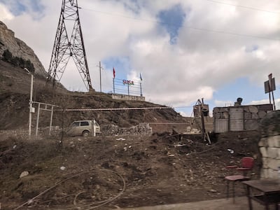A sign bearing the flags of Azerbaijan and Turkey outside the city of Shushi in Nagorno-Karabakh displays its Azerbaijani name, Susha. Neil Hauer for The National