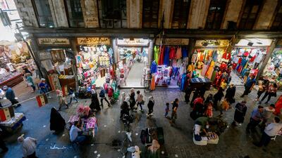 Syrian shoppers walk in the bazaar in old Damascus. AFP