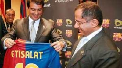 Mohammad Omran, right, the chairman of Etisalat, and Joan Laporta Estruch, the president of Barcelona FC, have penned in a four-year marketing deal.