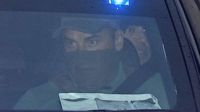 Daniel Kinahan, in the back of a police car, leaving a court in Dublin where he was remanded in custody charged with directing an organised crime group, after being extradited from Dubai. Getty Images