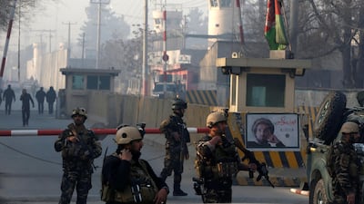 Afghan security forces keep watch at a checkpoint close to the compound of Afghanistan's national intelligence agency in Kabul on December 25, 2017. Omar Sobhani / Reuters