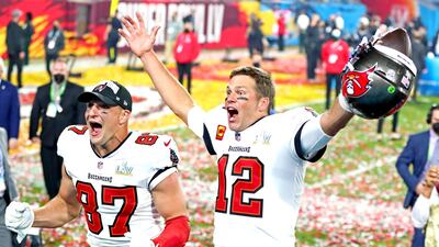 Tampa Bay Buccaneers quarterback Tom Brady (12) and tight end Rob Gronkowski (87) celebrate after beating the Kansas City Chiefs in Super Bowl LV at Raymond James Stadium. Reuters