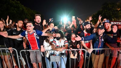 Paris Saint-Germain supporters celebrate outside the team hotel in Lisbon. AFP