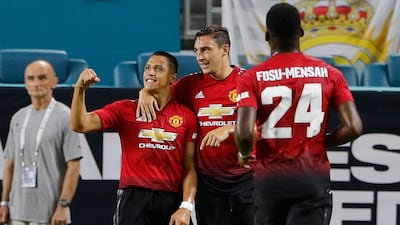 Manchester United forward Alexis Sanchez, left, celebrates his goal with teammates Matteo Darmian and Timothy Fosu-Mensah. EPA