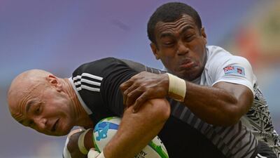 New Zealand’s DJ Forbes, left, is the most successful captain in rugby sevens history. Kirill Kudryavtsev / AFP