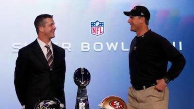San Francisco 49ers head coach Jim Harbaugh (pictured right) and his brother, Baltimore Ravens head coach John Harbaugh. REUTERS / Jim Young