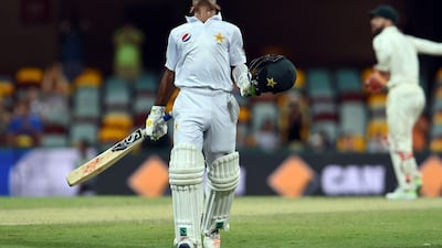 Pakistan batsman Asad Shafiq celebrates his century during the fourth day of the day-night cricket Test match between Australia and Pakistan in Brisbane on December 18, 2016. Saeed Khan / AFP