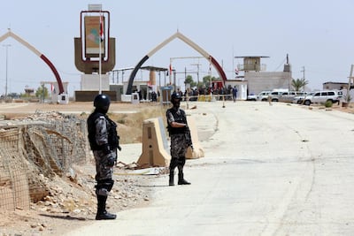 Jordanian security forces stand guard at the Al Karameh border point with Iraq on August 30, 2017. AFP