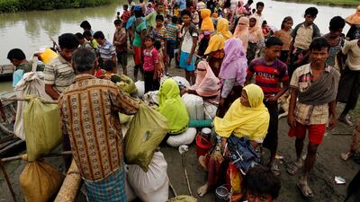Rohingya refugees are seen waiting for a boat to cross the border through the Naf river in Maungdaw, Myanmar. Reuters / Mohammad Ponir Hossain