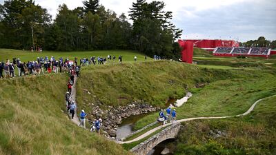 Team Europe's Jon Rahm and Tyrrell Hatton make their way to the eighteenth green. Getty
