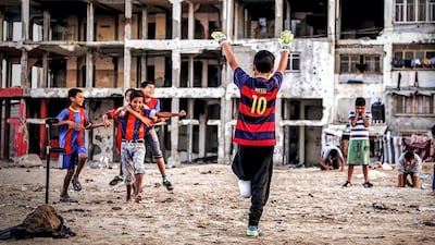 1st place (2018): Mohammed, Palestine: 'This photo was taken from Gaza. Though the siege it falls under and the obstacles it faces, it spreads hope and joy. Notwithstanding all these hardships, those people with innocent hearts practise their favourite hobby and play football amid the debris of their ruined houses. They are sharing moments of joy in the middle of long-lasting suffering. This is our hero Abdullah who lost his leg but never loses hope.' Courtesy National Geographic
