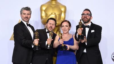 Mark Ardington, from left, Paul Norris, Sara Bennett and Andrew Whitehurst pose with the award for best visual effects for Ex Machina in the press room at the Oscars. Jordan Strauss / Invision / AP