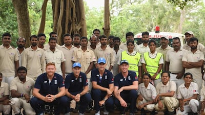 England players, left to right, Jonny Bairstow, Joe Root, Olly Stone and Keaton Jennings fitted out with de-mining personal protective equipment pictured with members of MAG after their tour. Getty Images