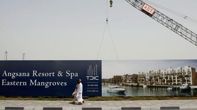 The Eastern Mangroves Hotel was hidden from view by advertising hoardings ....