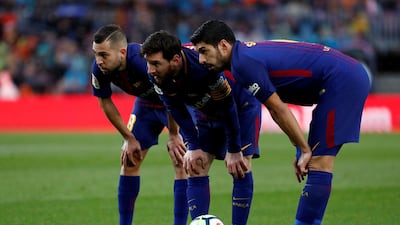 Jordi Alba, Lionel Messi and Luis Suarez will be well aware of how precarious Barcelona's position at the top of the Primera Liga table is. Reuters