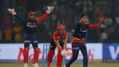 Sandeep Lamichhane, right, made his Indian Premier League debut for Delhi Daredevils against Royal Challengers Bangalore. Altaf Qadri / AP Photo
