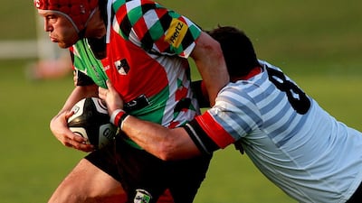 Abu Dhabi Saracens, in white, have emerged as a viable alternative to Abu Dhabi Harlequins, in red, in the capital. Satish Kumar / The National