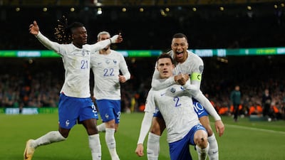 France's Benjamin Pavard celebrates with Kylian Mbappe, Eduardo Camavinga and Theo Hernandez after scoring against the Republic of Ireland in their Euro 2024 qualifiers at the Aviva Stadium in Dublin. Reuters