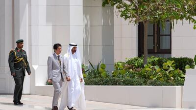 Sheikh Mohammed bin Zayed, Crown Prince of Abu Dhabi and Deputy Supreme Commander of the UAE Armed Forces, right, receives Shinzo Abe, Prime Minister of Japan, second right, during a reception at the Presidential Palace. Hamad Al Mansouri for Crown Prince Court - Abu Dhabi
