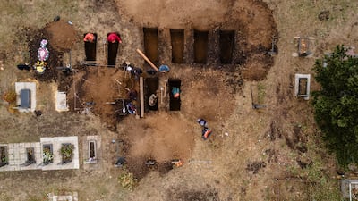 Gravediggers prepare the burial site for victims of a Russian missile strike in Hroza in 2023. Getty Images