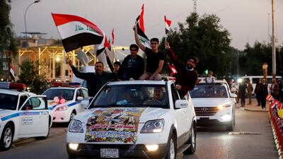 Cars drive over a suspension bridge in the Green Zone in Baghdad. Reuters