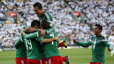 Mexico became the second-to-last team in the World Cup on Wednesday by finishing off a 9-3 aggregate victory over New Zealand. Anthony Phelps / Reuters