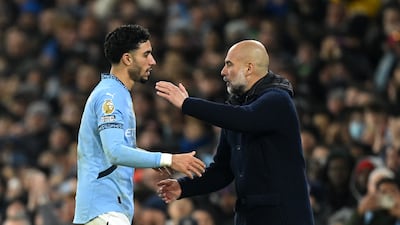 Omar Marmoush of Manchester City is embraced by Pep Guardiola, manager of Manchester City, after being substituted. Getty Images