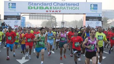 Runners competing in the 10km race at the Standard Chartered Dubai Marathon. Antonie Robertson/The National