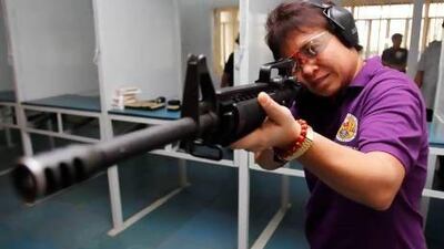 The Philippines' chief tax collector is constantly thinking about targets. Sometimes she picks up an assault rifle and hits them.