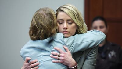 Heard hugged her attorney Elaine Bredehoft after she testified one last time. EPA