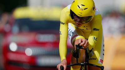 UAE Team Emirates' Tadej Pogacar, wearing the yellow jersey, crosses the finish line after stage 7 on July 5. Reuters