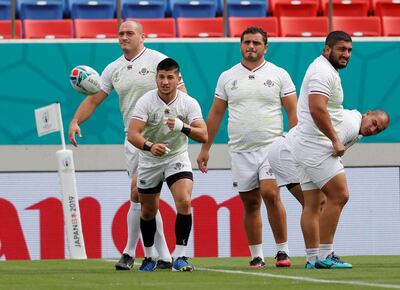 Georgia's Gela Aprasidze and other players in Osaka. Reuters