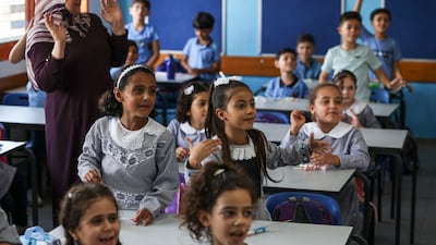 In happier times, pupils attend class in a school run by UNRWA in Gaza City. The UN says 80 per cent of schools in the territory have been destroyed or damaged. AFP