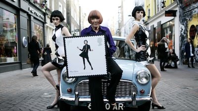 In 2009, Mary Quant, centre, poses with models in Carnaby Street, London. AP