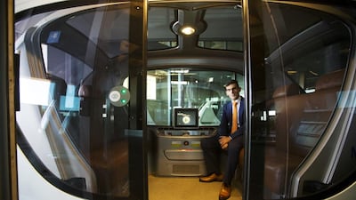 Karim Karam, professor of engineering systems management, sits in a driverless vehicle at the Masdar Institute in Abu Dhabi. Christopher Pike / The National