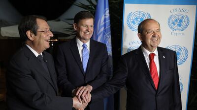 UN envoy Colin Stewart, centre, with Cyprus President Nicos Anastasiades, left, and Turkish Cypriot leader Ersin Tatar during a reception in Nicosia. Photo: EPA