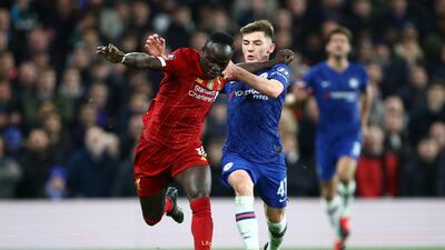 Billy Gilmour challenges Liverpool forward Sadio Mane for the ball. Reuters