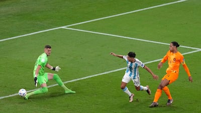 Nahuel Molina finishes past Dutch goalkeeper Andries Noppert to score for Argentina. AP