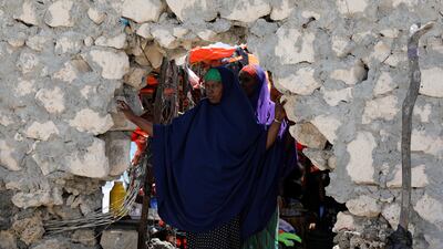 A Somali woman looks out from an opening in a wall on a beach in Mogadishu, Somalia, October 25, 2017. Marius Bosch / Reuters
