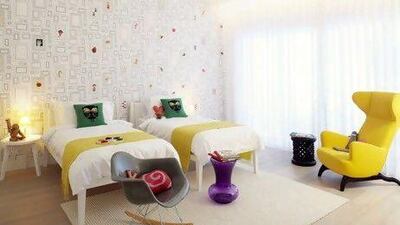 A yellow Ardea arm chair by Zanotta, Starck's La Boheme Stool for Kartell and locally bought throws set off Frames wallpaper by Graham and Brown. Francis Amiand