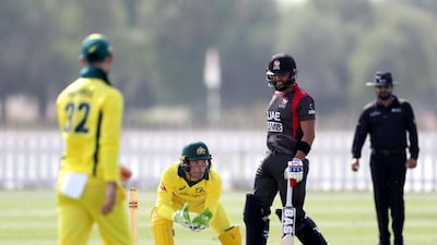 Alex Carey of Australia gathers the ball.