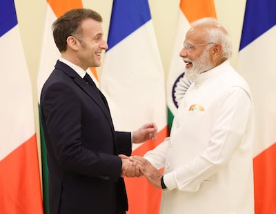 Indian Prime Minister Narendra Modi, right, with French President Emmanuel Macron in Mumbai. Mr Macron began a three-day visit to India to discuss artificial intelligence co-operation as the country hosts the AI Impact Summit from February 16-20, in New Delhi. EPA