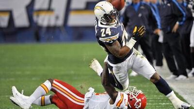 San Diego Chargers' Ryan Mathews is hooked by Kansas City defensive back Javier Arenas