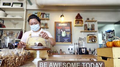 Industry insiders are urging both restaurants and diners to take necessary precautions to help drive down Covid-19 cases. Chris Whiteoak / The National