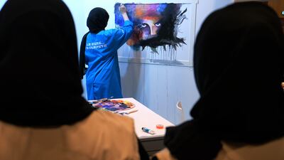 Abrar Alhammadi with her entry in the EmiratesSkills competition’s painting category at Adnec on Tuesday. Delores Johnson / The National